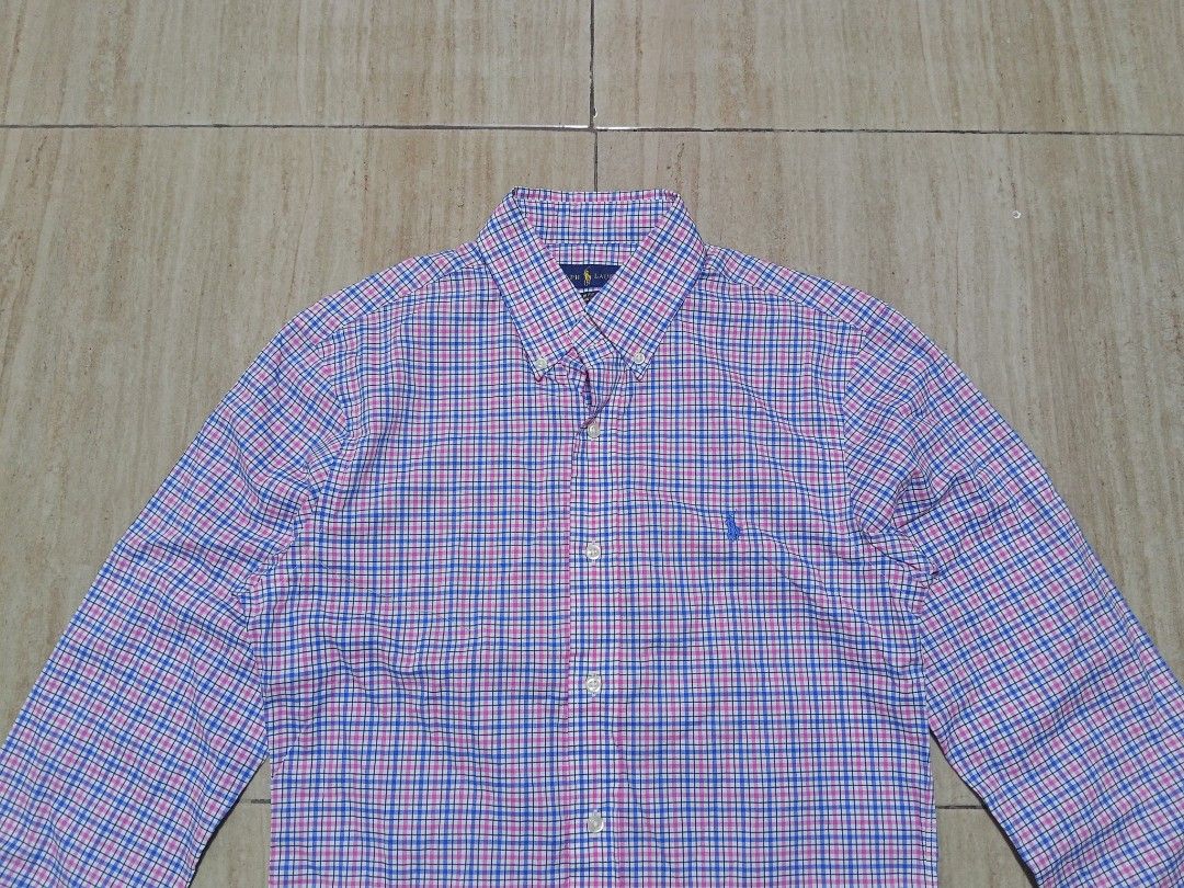 Ralph Lauren Slim Fit Button Down Shirt Size S (Category: Tshirts & Polo Shirts ) located in Glan. Submitted by cpaharodde48008 (Listing ID 1460427164, Image 3). Description: - Brand: Ralph Lauren - Fit: Slim Fit - Material: 100% Cotton Stretch - Design: Classic Plaid (Blue, Pink, White) - Features: Signature Pony Logo on Chest - Occasion: Casual to Smart Casual Wear.