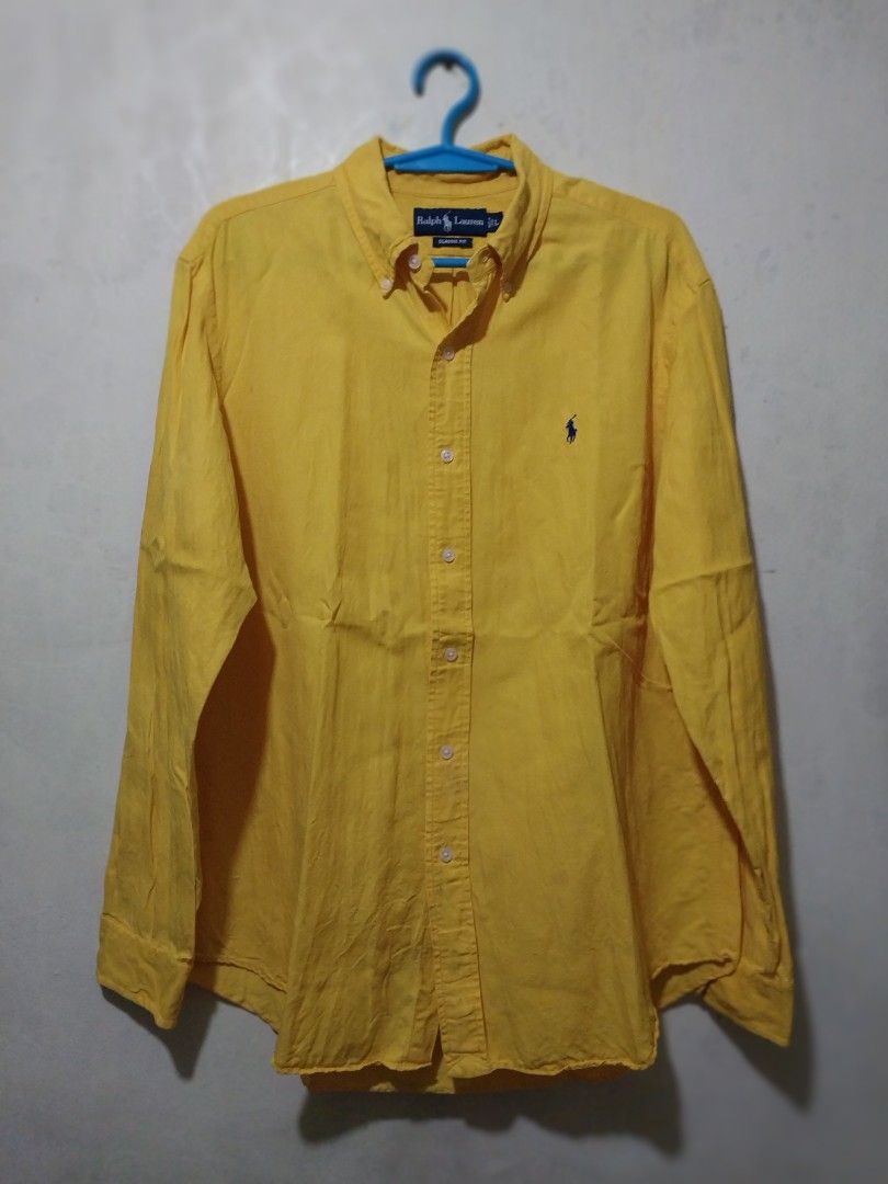 Ralph Lauren Yellow Long Sleeve Shirt (Category: Tshirts & Polo Shirts ) located in Manila. Submitted by PrinceDani.Clothing (Listing ID 1460440607, Image 1). Description: Ralph Lauren yellow longsleeves large on tag 26in width 30-32in length issue: stains/ 1 hole below pony .