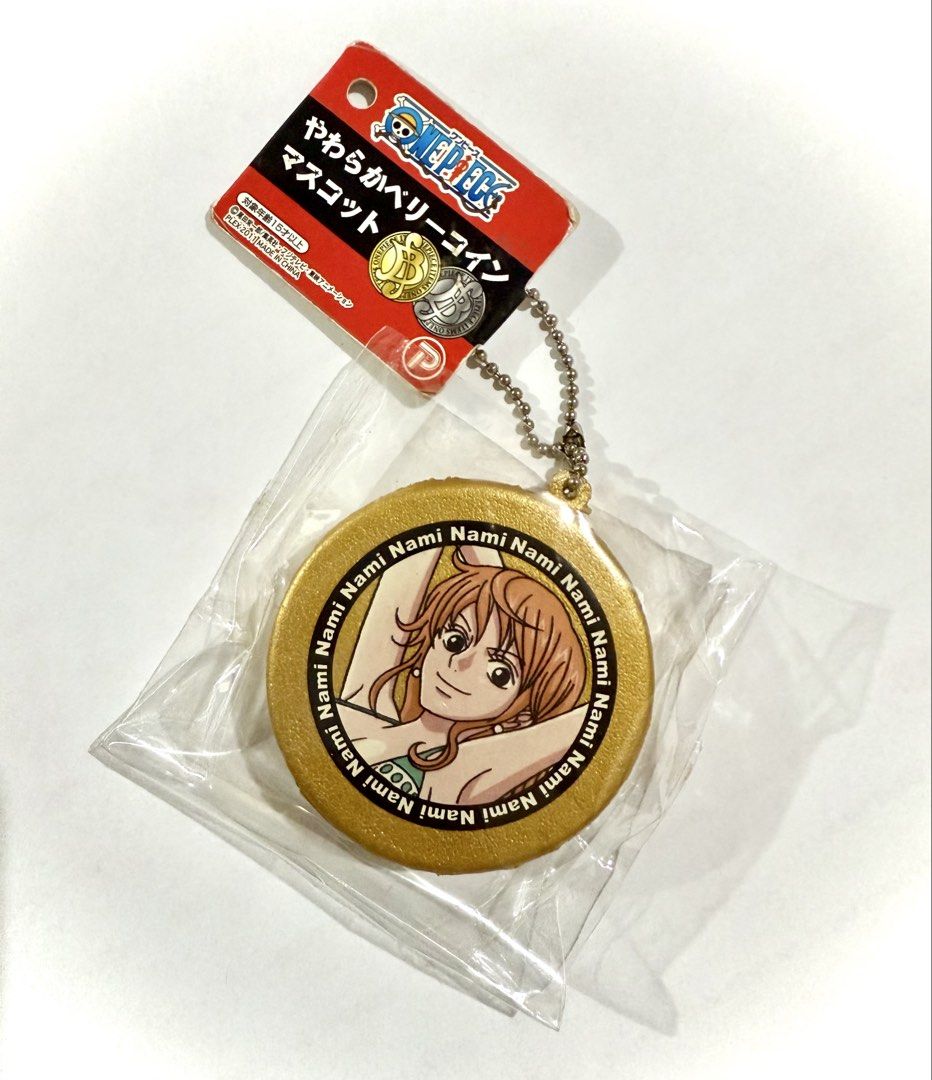 RARE One Piece Nami coin squishy (Category: Designer & Blind Box Toys) located in Calamba. Submitted by jung_05 (Listing ID 1460485806, Image 1). Description: ✦ Nami squishy keychain ✦ Comes with original intact Japanese tag ✦ Original packaging included ✦ Back has no defects ✦ Perfect collectible for One Piece & Nami collectors ✦ Unique / hard-to-find Japanese squishy 📌 CONDITION: (Please note that this is an old squishy and defects are normal)