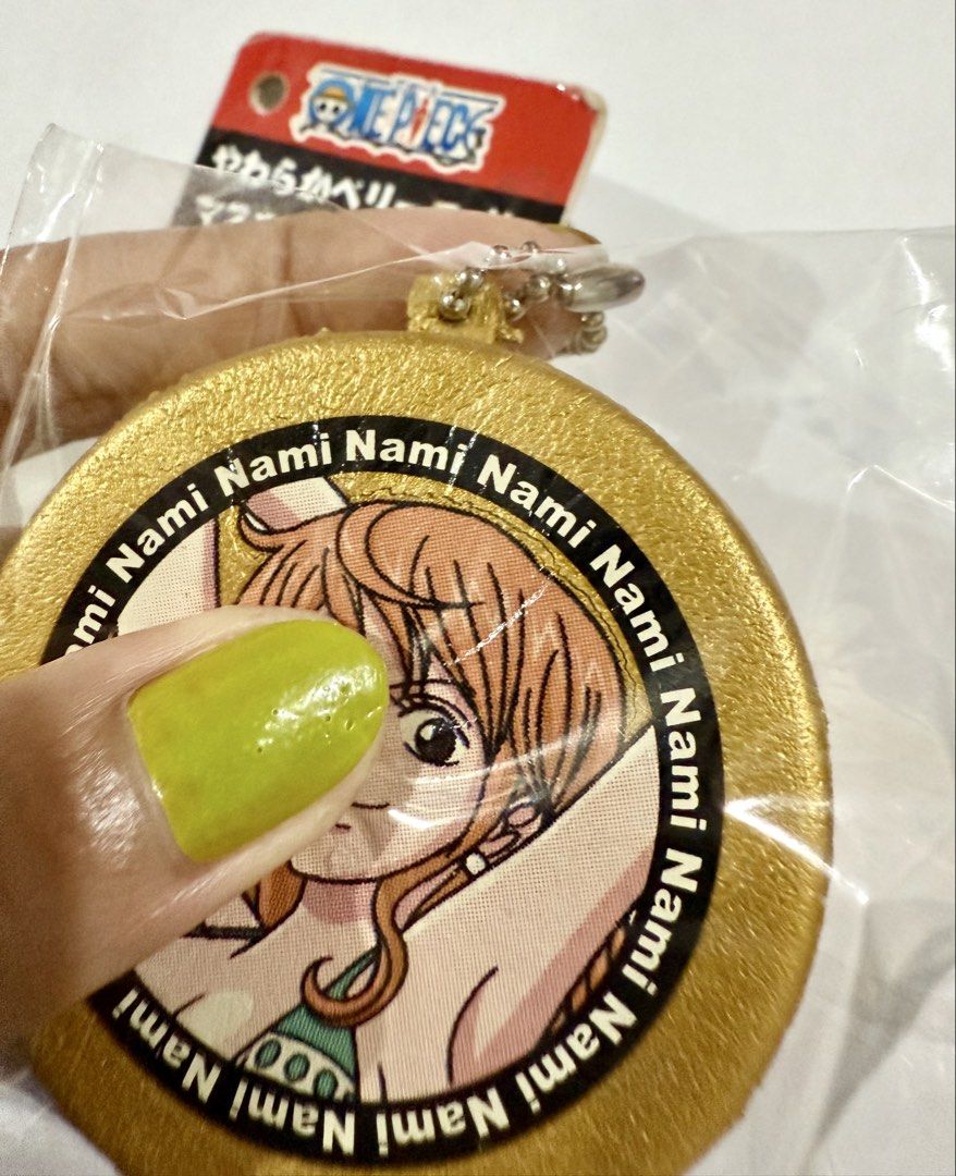 RARE One Piece Nami coin squishy (Category: Designer & Blind Box Toys) located in Calamba. Submitted by jung_05 (Listing ID 1460485806, Image 3). Description: ✦ Nami squishy keychain ✦ Comes with original intact Japanese tag ✦ Original packaging included ✦ Back has no defects ✦ Perfect collectible for One Piece & Nami collectors ✦ Unique / hard-to-find Japanese squishy 📌 CONDITION: (Please note that this is an old squishy and defects are normal)