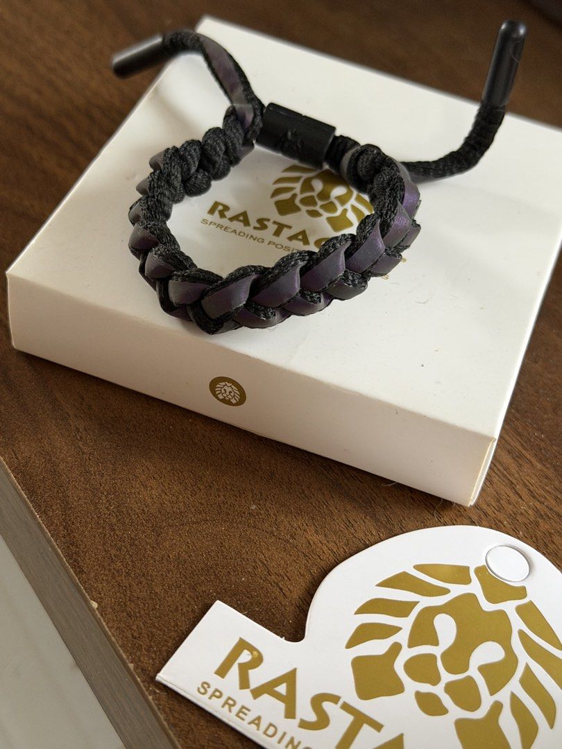 Rastaclat Bracelet Black Purple (Category: Bracelets) located in Manila. Submitted by carlaleyyydonato (Listing ID 1460400602, Image 2). Description: - Rastaclat bracelet - Color: Black with purple accents - Design: Braided - Features: Adjustable strap with clasp closure - Includes: Original box and tag - Style: Great accessory for any outfit.