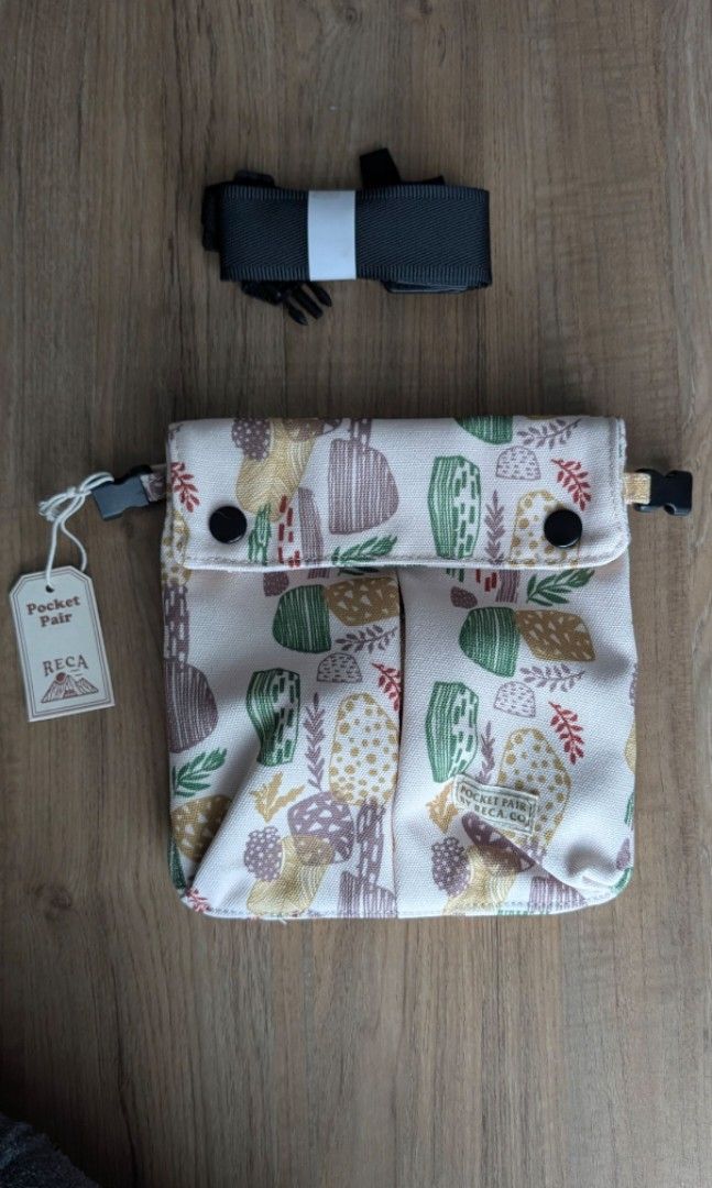 RECA Pouch Bag (Category: Purses & Pouches) located in Makati City. Submitted by hanakurin (Listing ID 1460367222, Image 1). Description: - Color: Cream with plant prints - Main zippered compartment - Detachable strap - Brand new with tag still attached - detachable magnetic back compartment RFS: - got too many bags, won't be using.