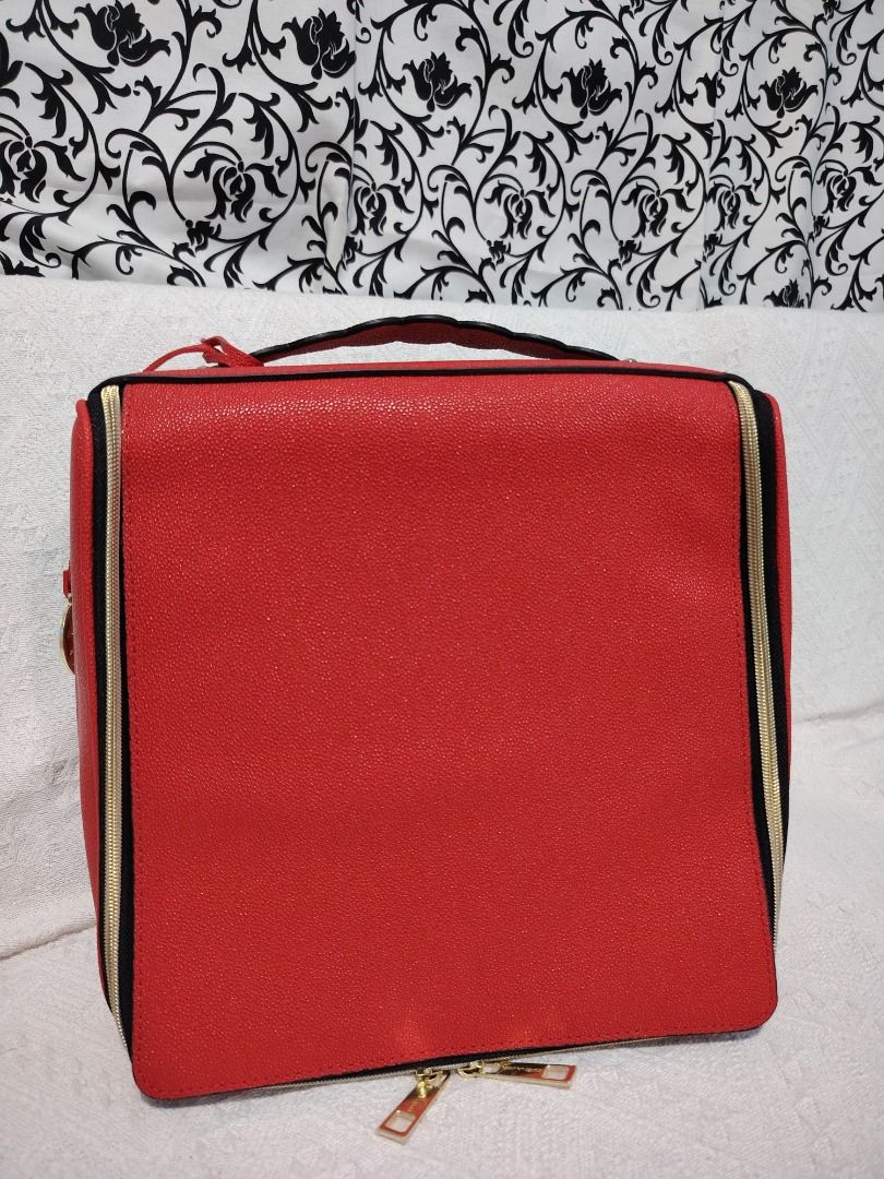 Red Cosmetic Bag with Black Trim (Category: Luxury Bags & Wallets) located in Manila. Submitted by theshopandsmile (Listing ID 1460448513, Image 1). Description: - Vibrant red cosmetic bag with stylish black trim. - Secure zippered closure to keep your items safe. - Spacious interior, perfect for all your makeup and toiletries. - Easy-to-clean lining for hassle-free maintenance. - Ideal for organizing your essentials on the go..