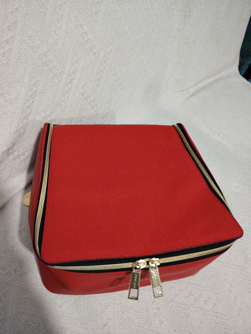 Red Cosmetic Bag with Black Trim (Category: Luxury Bags & Wallets) located in Manila. Submitted by theshopandsmile (Listing ID 1460448513, Image 3). Description: - Vibrant red cosmetic bag with stylish black trim. - Secure zippered closure to keep your items safe. - Spacious interior, perfect for all your makeup and toiletries. - Easy-to-clean lining for hassle-free maintenance. - Ideal for organizing your essentials on the go..