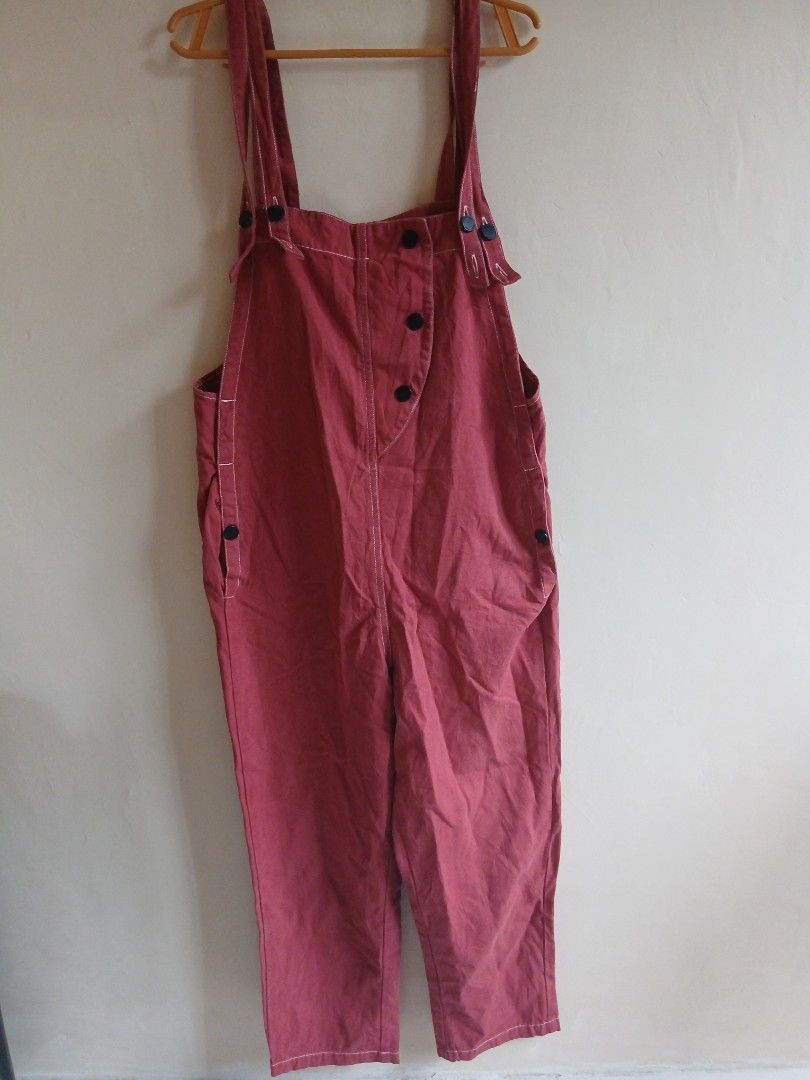Red Cotton Overalls with Button Details (Category: Jumpsuits) located in Tayabas. Submitted by ahrcelllego (Listing ID 1460319420, Image 1). Description: - Red overalls - Cotton-like material - Button closures on sides and straps - White contrast stitching - Front pockets - Ideal for casual wear - Ready for a new home.