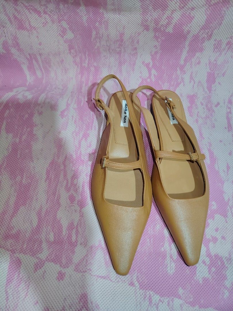 Reike Nen Slingback Flats Tan Leather Pointed Toe Size 37.5 (Category: Flats & Sandals) located in Cavite. Submitted by kys777 (Listing ID 1460478721, Image 1). Description: - Brand: Reike Nen - Type: Slingback Flats - Material: Tan Leather - Design: Pointed toe - Features: Delicate front strap, adjustable buckle heel strap - Origin: Made in Korea - Size: 37.5 - Style: Super chic and versatile, great for dressing up or down.