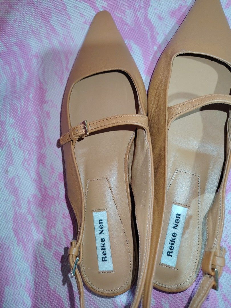 Reike Nen Slingback Flats Tan Leather Pointed Toe Size 37.5 (Category: Flats & Sandals) located in Cavite. Submitted by kys777 (Listing ID 1460478721, Image 2). Description: - Brand: Reike Nen - Type: Slingback Flats - Material: Tan Leather - Design: Pointed toe - Features: Delicate front strap, adjustable buckle heel strap - Origin: Made in Korea - Size: 37.5 - Style: Super chic and versatile, great for dressing up or down.