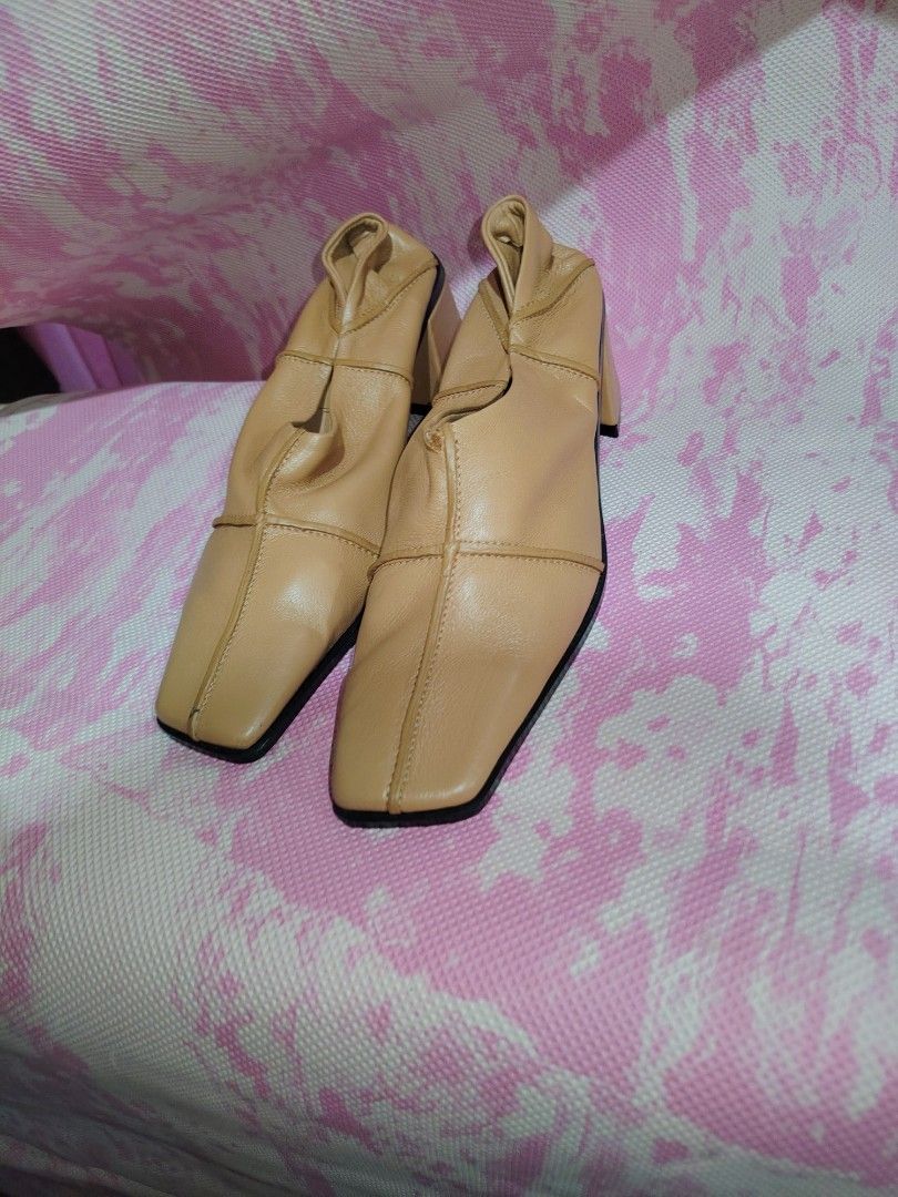 Reike Nen Square Toe Ruched Heels (Category: Heels) located in Cavite. Submitted by kys777 (Listing ID 1460478858, Image 1). Description: - Brand: Reike Nen - Color: Neutral Tan - Design: Square toe with ruched detailing - Heel Type: Comfortable block heel - Condition: Soles show minimal wear - Style: Perfect for dressing up or down.