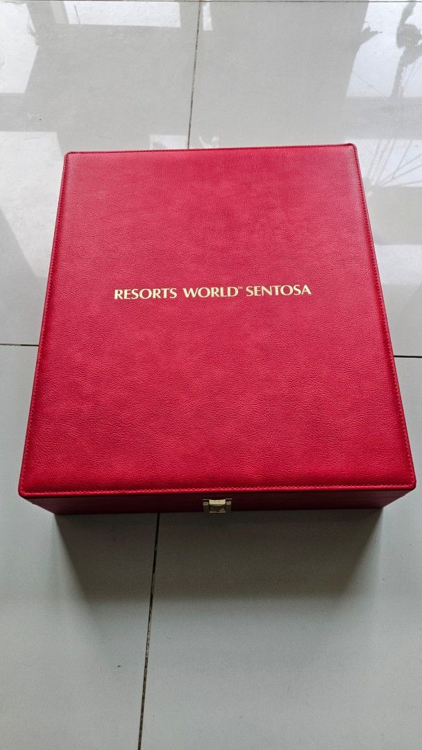 Resorts World Sentosa Red Presentation Box (Category: Accessory Holder, Box & Organizers) located in Cebu City. Submitted by itrakhimch28871 (Listing ID 1460400856, Image 1). Description: - Genuine Resorts World Sentosa presentation box. - Features a secure gold clasp closure. - Interior includes four frame slots. - Also has a smaller compartment for additional items. - Comes with ribbon ties for securing contents. - Ideal for storing cherished m