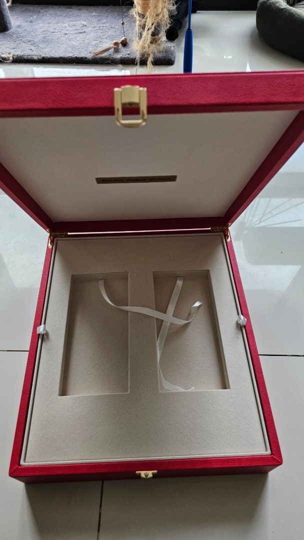 Resorts World Sentosa Red Presentation Box (Category: Accessory Holder, Box & Organizers) located in Cebu City. Submitted by itrakhimch28871 (Listing ID 1460400856, Image 2). Description: - Genuine Resorts World Sentosa presentation box. - Features a secure gold clasp closure. - Interior includes four frame slots. - Also has a smaller compartment for additional items. - Comes with ribbon ties for securing contents. - Ideal for storing cherished m