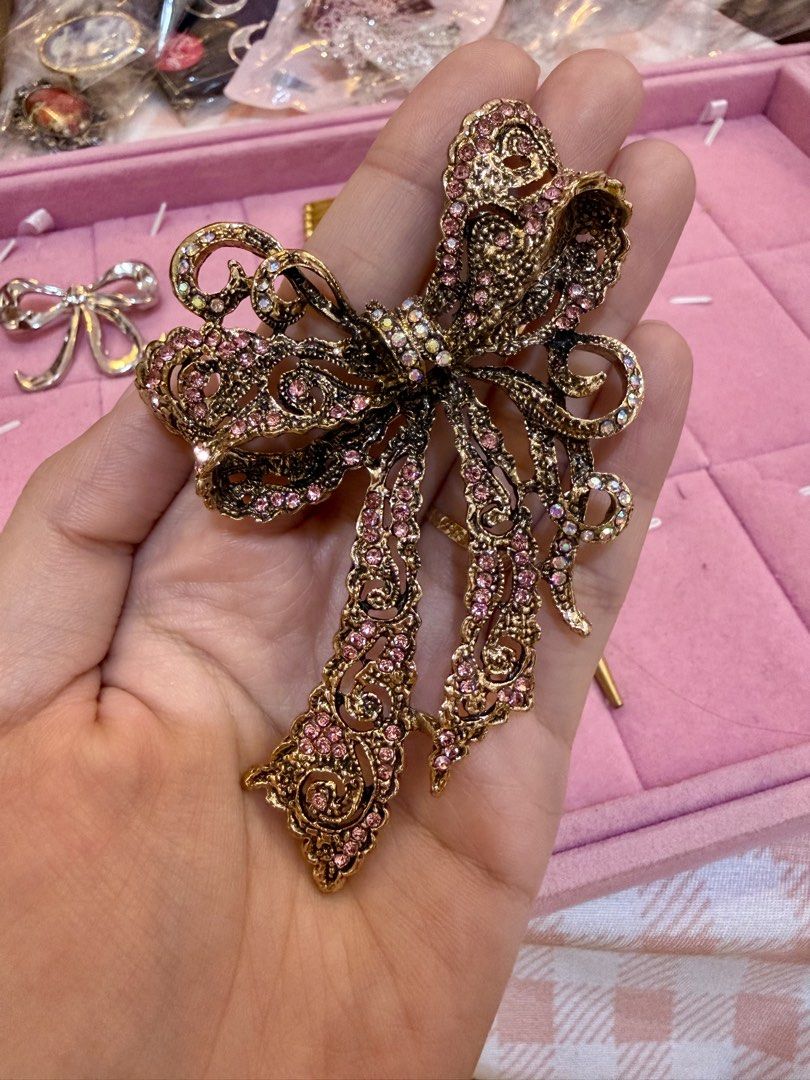 Ribbon Bow Brooches (Category: Brooches) located in Caloocan City. Submitted by fashionshop248 (Listing ID 1460317585, Image 3). Description: Vintage Brooch from Japan ₱350 each 3 gold ribbon ₱100 silver ribbon.