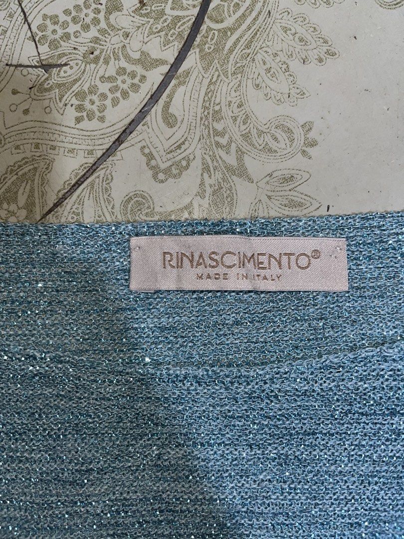 RINASCIMENTO Teal Glitter Batwing Knit Top (Category: Others Tops) located in Mexico. Submitted by amaya_thriftstore (Listing ID 1460445915, Image 2). Description: Color: Teal / Dusty Blue with shimmer Style: Oversized batwing sleeves, wide boat neck, ribbed knit Fabric: Lightweight knit with glitter lurex thread - may sparkle siya Vibes: Italian luxury, Glam casual, Evening / Party Best paired with: Highwaist pants, skirt, or leggings.