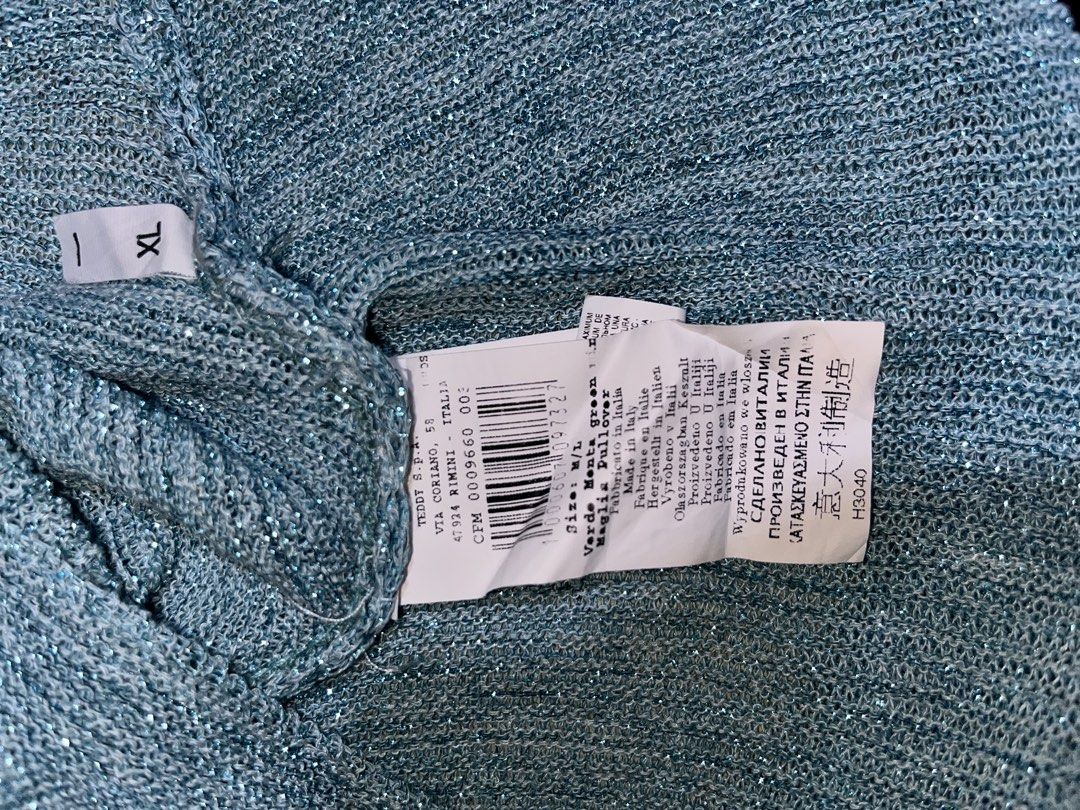 RINASCIMENTO Teal Glitter Batwing Knit Top (Category: Others Tops) located in Mexico. Submitted by amaya_thriftstore (Listing ID 1460445915, Image 3). Description: Color: Teal / Dusty Blue with shimmer Style: Oversized batwing sleeves, wide boat neck, ribbed knit Fabric: Lightweight knit with glitter lurex thread - may sparkle siya Vibes: Italian luxury, Glam casual, Evening / Party Best paired with: Highwaist pants, skirt, or leggings.