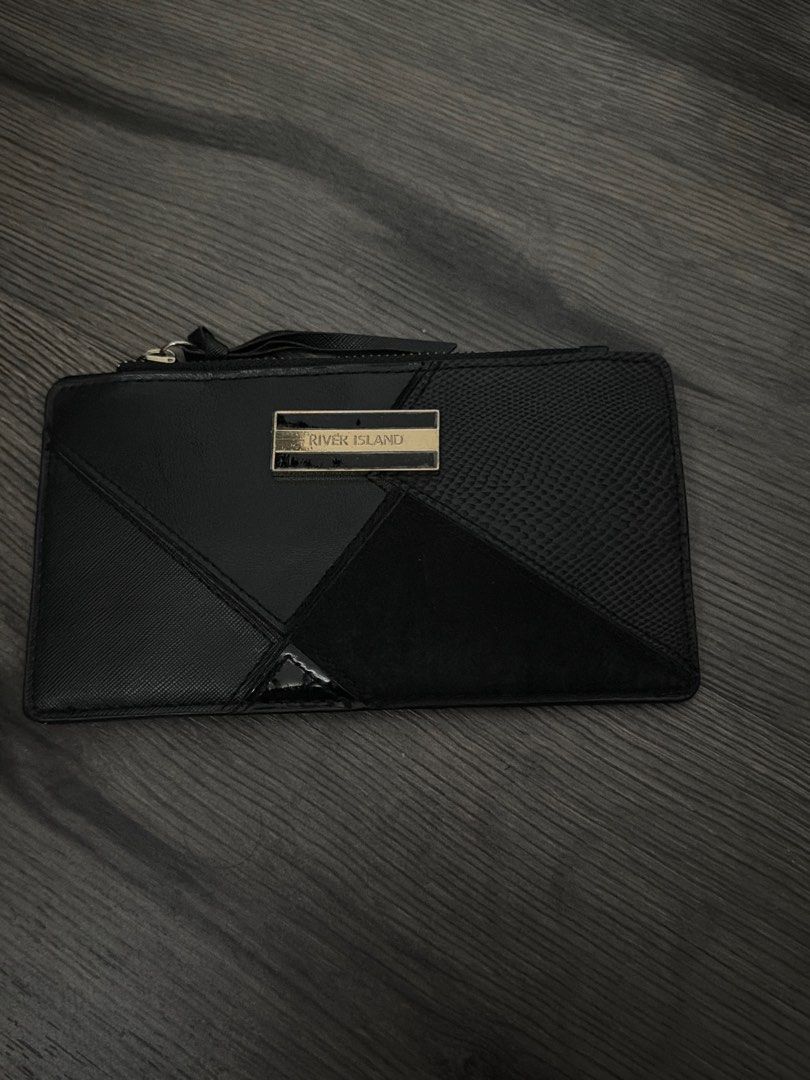 River Island Black Wallet (Category: Wallets & Card holders) located in Manila. Submitted by sushi.lover (Listing ID 1460364729, Image 1). Description: - Brand: Black River Island - Design: Geometric pattern on the front - Features: Internal zip compartment, multiple card slots - Includes: Separate card holder - Benefit: Perfect for organizing your essentials.