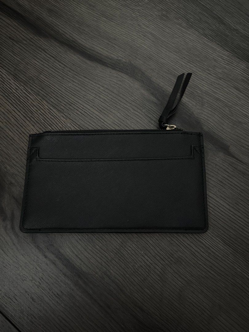 River Island Black Wallet (Category: Wallets & Card holders) located in Manila. Submitted by sushi.lover (Listing ID 1460364729, Image 3). Description: - Brand: Black River Island - Design: Geometric pattern on the front - Features: Internal zip compartment, multiple card slots - Includes: Separate card holder - Benefit: Perfect for organizing your essentials.