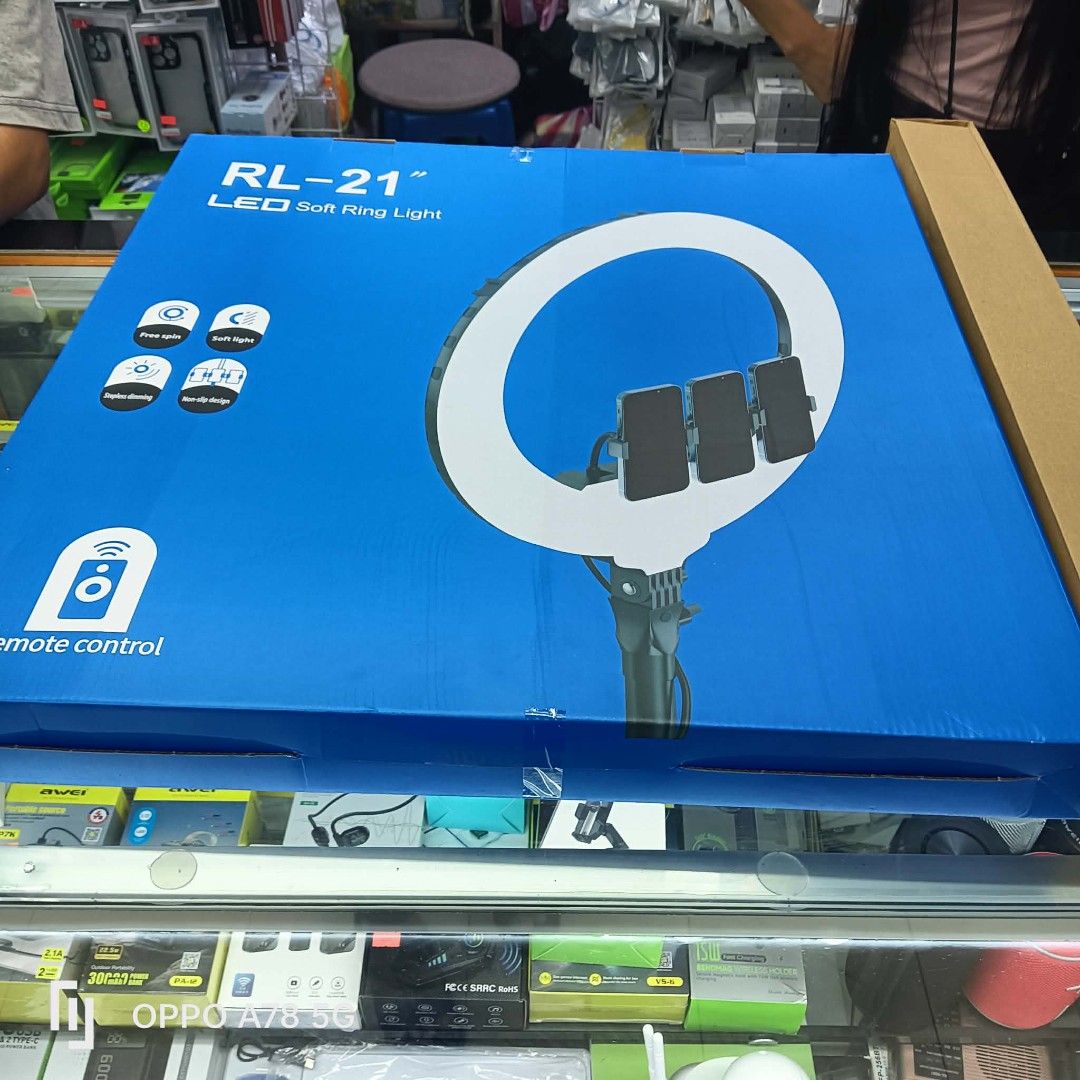 RL-21" LED Soft Ring Light with Phone Holders (Category: Rings) located in Manila. Submitted by iliasjen3082126 (Listing ID 1460412567, Image 2). Description: - 21-inch LED Soft Ring Light - Multiple phone holders in the center - Ideal for content creators and photography/videography - Includes remote control - Original box included.