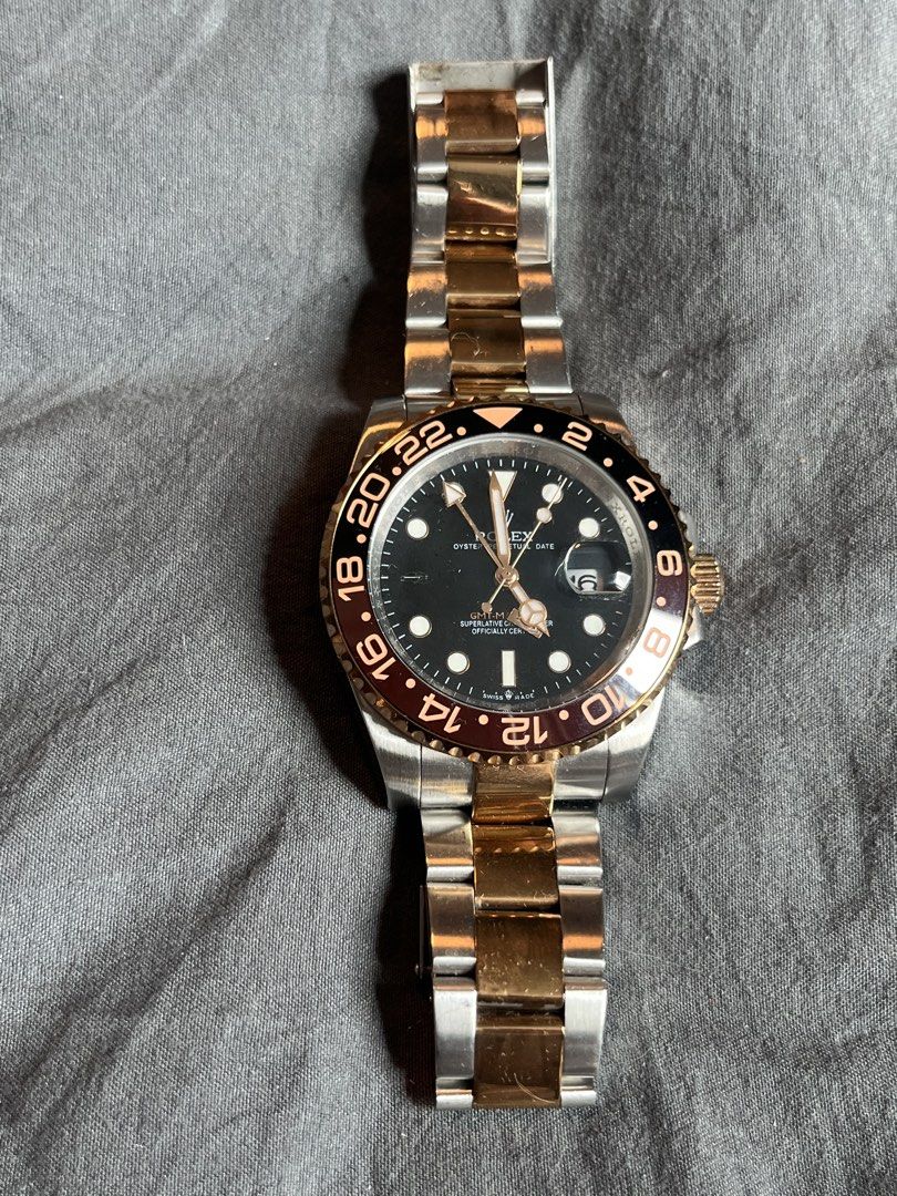 Rolex GMT-Master II Two-Tone Automatic Watch (Category: Luxury Watches) located in Makati City. Submitted by GoddessCloset (Listing ID 1460470769, Image 1). Description: - Rolex GMT-Master II - Two-tone stainless steel and gold construction - Classic black dial with date function - Rotating bezel for tracking multiple time zones - Reliable automatic movement - Pre-owned with visible wear, but in great overall condition - Ready for its next advent