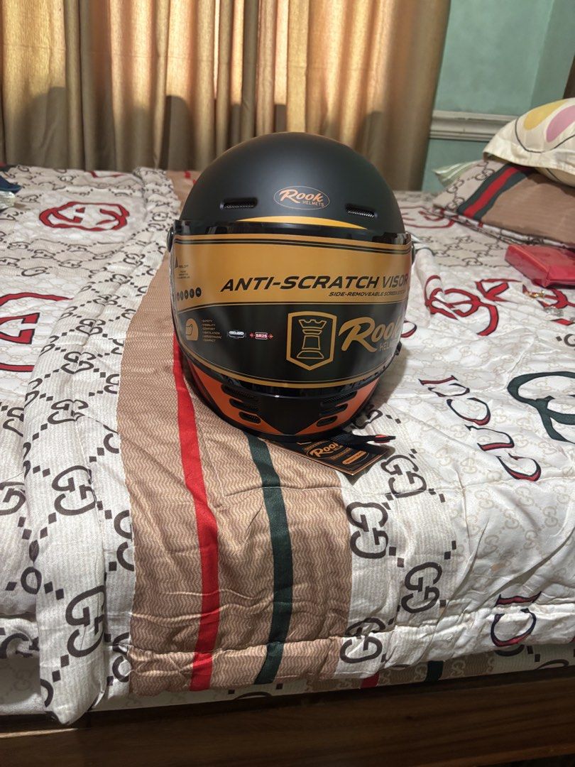 Rook Helmets V152(E70) Anti-Scratch Visor Motorcycle Helmet (Category: Helmets and other Riding Gears) located in Pasig City. Submitted by thomassan90333 (Listing ID 1460371783, Image 1). Description: - Rook Helmets V152(E70) Motorcycle Helmet (Syracuse colorway) - Color: Matte Black with Orange, Yellow, and Red Stripes - Size: L (59-60cm) - Certification: ECE R.22.05 Certified - Weight: Lightweight at 1350±50g - Features: Anti-scratch visor - Id