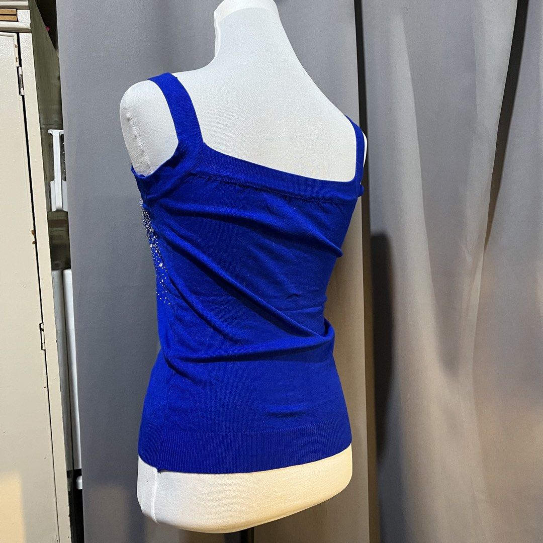 Royal Blue Sequin Rhinestone Tank Top (Category: Sleeveless) located in Manila. Submitted by madfitzz (Listing ID 1460503581, Image 2). Description: - Royal blue tank top - Sparkly embellishments on the front - Square neckline - Spaghetti straps - Ribbed hem - Versatile for layering or wearing alone - Comfortable and eye-catching.
