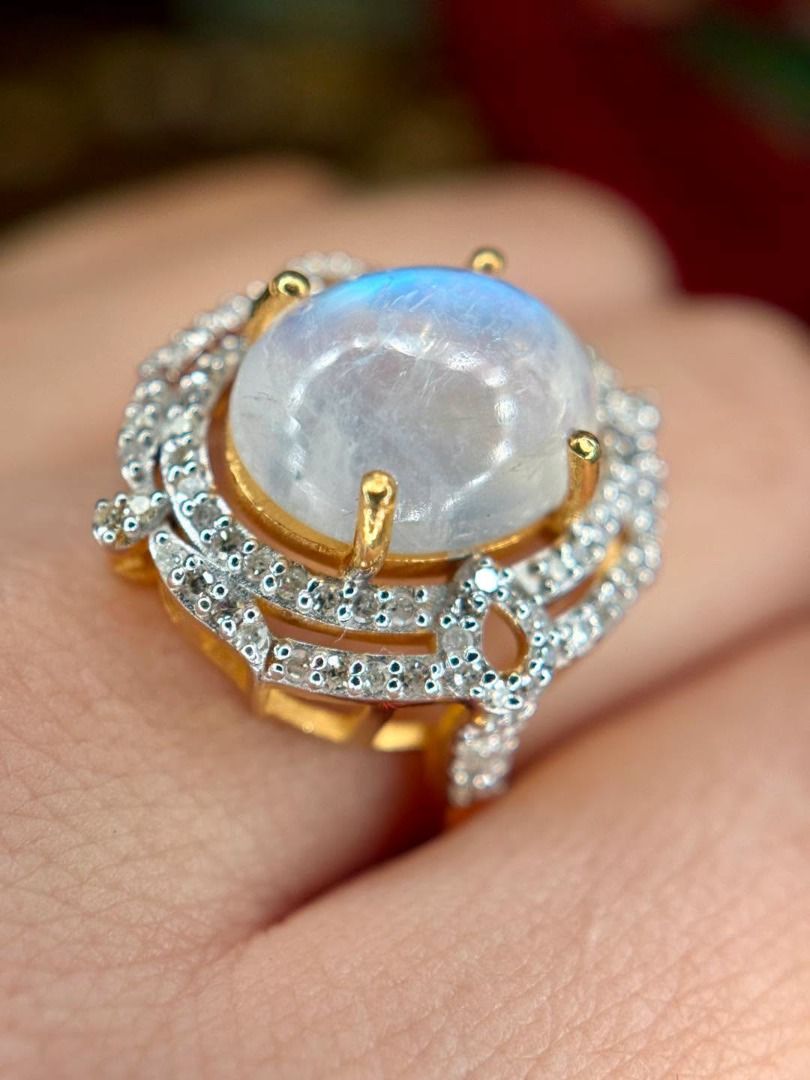 S7 Natural Madagascar Moonstone Ring (Category: Rings) located in Baguio. Submitted by asna_taku (Listing ID 1460406919, Image 2). Description: ✨ A MOONSTONE DREAM WITH THAT MAGICAL BLUE GLOW! ✨ Natural Madagascar Moonstone with beautiful blue adularescence, oval cabochon cut, framed with natural diamonds for extra sparkle. 🤍💎 925 Silver • Yellow Gold Plated Natural diamond accents ~0.35ct Size 7 With AGA certificate for the natural Madagascar 