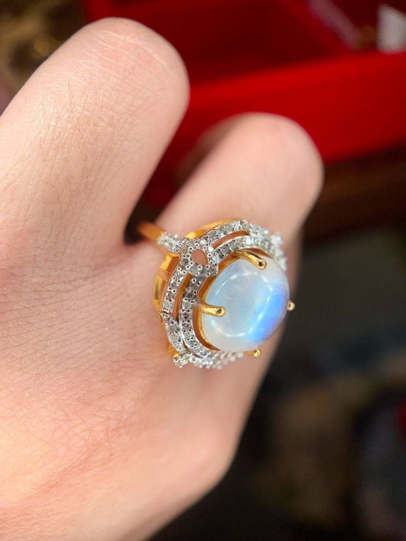 S7 Natural Madagascar Moonstone Ring (Category: Rings) located in Baguio. Submitted by asna_taku (Listing ID 1460406919, Image 3). Description: ✨ A MOONSTONE DREAM WITH THAT MAGICAL BLUE GLOW! ✨ Natural Madagascar Moonstone with beautiful blue adularescence, oval cabochon cut, framed with natural diamonds for extra sparkle. 🤍💎 925 Silver • Yellow Gold Plated Natural diamond accents ~0.35ct Size 7 With AGA certificate for the natural Madagascar 