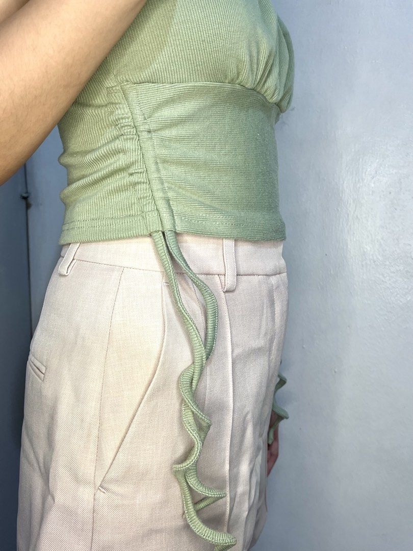 Sage Green Ruched Cami Top (Category: Blouses) located in Marikina City. Submitted by trish.grcia (Listing ID 1460379758, Image 3). Description: • Ribbed & ruched detail • Adjustable side ties • Stretchy fit • Preloved, good condition .