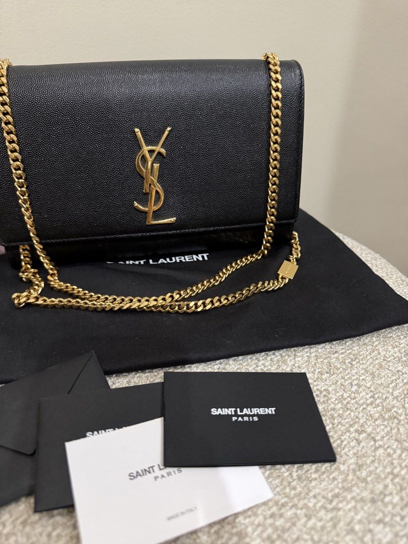 YSL Kate in medium (Category: Luxury Bags & Wallets) located in Quezon City. Submitted by happy_findds (Listing ID 1460438763, Image 2). Description: - Authentic pre loved Saint Laurent Kate in medium - Material: Black pebbled leather - Hardware: Gold-tone YSL logo - Condition: Great exterior, clean interior - Includes: Dust bag and authenticity cards - Strap: can wear crossbody or on shoulder o can be use as handbag.