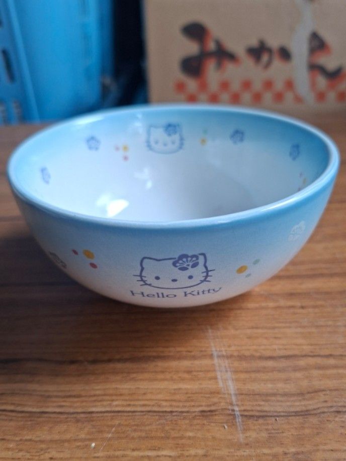 Sanrio Hello Kitty Light Blue Bowl (Category: Other Kitchenware & Tableware) located in Consolacion. Submitted by luxekerei (Listing ID 1460121541, Image 1). Description: - light blue ceramic Sanrio Hello Kitty bowl featuring a graphic of Hello Kitty on the front with subtle pastel floral accents along the inside rim..