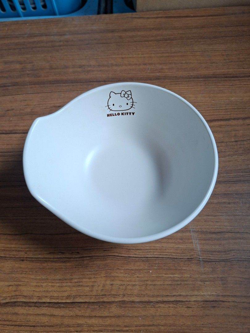 Sanrio Hello Kitty Small Serving Bowl (Category: Other Kitchenware & Tableware) located in Consolacion. Submitted by luxekerei (Listing ID 1460332272, Image 1). Description: - Sanrio Hello Kitty ceramic small serving bowl featuring a minimalist black outline of Hello Kitty's face and the signature logo..