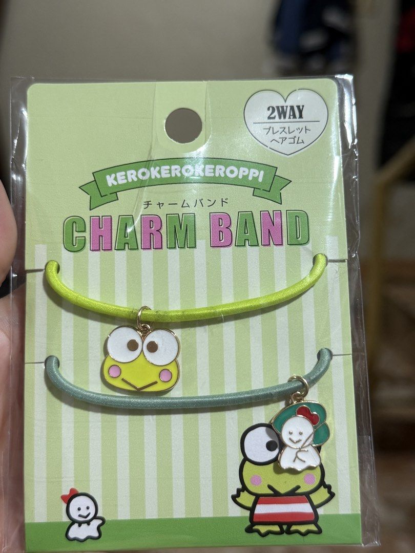 Sanrio Keroppi (Category: Other Accessories) located in Pasig City. Submitted by jointeamqu40916 (Listing ID 1460339935, Image 1). Description: - Set of 2 cute Keroppi charm bands. - Can be used as hair ties or bracelets. - One band features Keroppi. - Second band includes Keroppi and a little ghost charm. - Perfect accessory for Sanrio fans and adding a fun touch to your look..