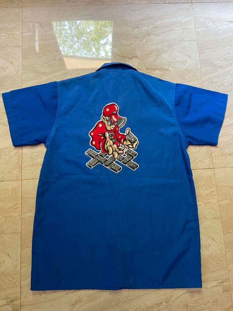 SCHOOL OF HARD KNOCKS Y2K POLO (Category: Tshirts & Polo Shirts ) located in Manila. Submitted by lilsintenel (Listing ID 1460399221, Image 2). Description: - Cool blue short sleeve button up shirt - 20x 27 - Features a fun graphic print on the front and back - Includes a convenient chest pocket - Ideal for casual everyday wear.