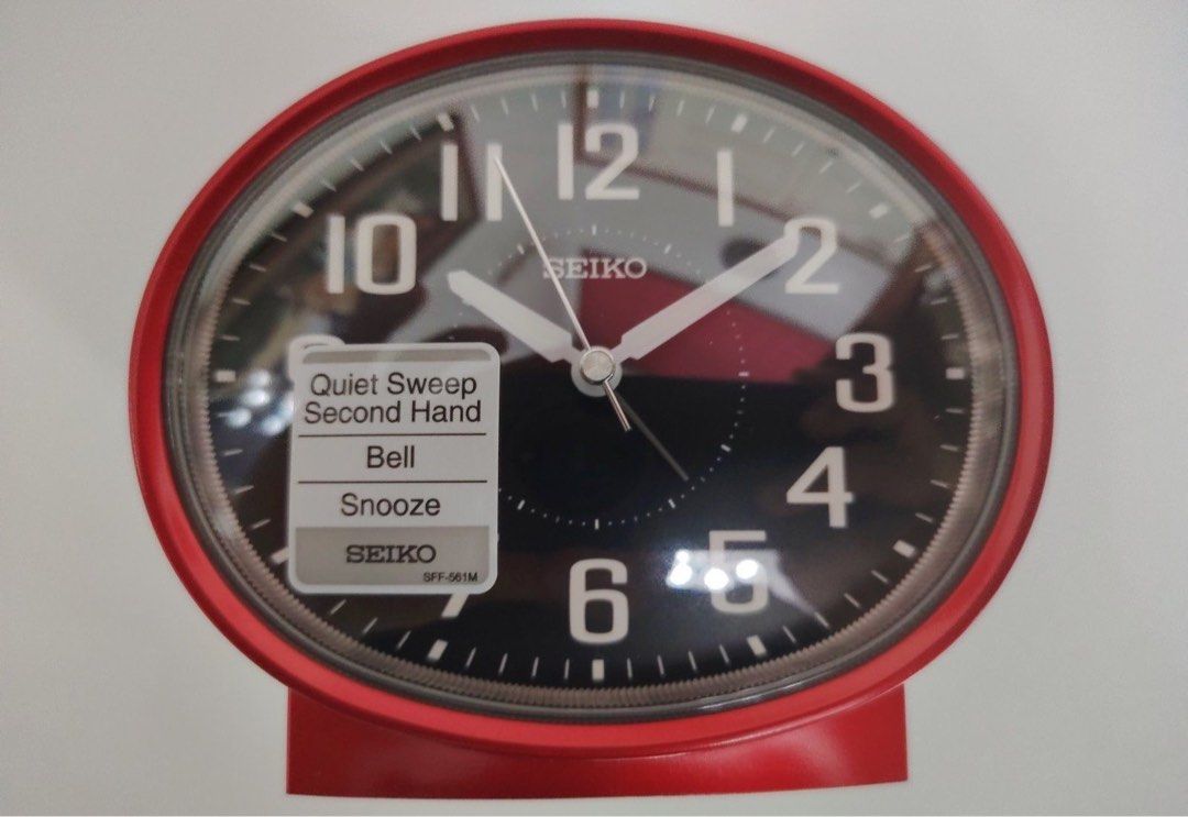 Seiko Clock QHK059R (Category: Clocks) located in Manila. Submitted by seikowatchfactory (Listing ID 1460397228, Image 2). Description: Brand New in Box Authentic Seiko Alarm Clock 10/10 Model: QHK059R Price: 1880 pesos Specifications: Brand: Seiko Diameter: 11.2cm Width: 13cm Depth: 8.1cm Beep alarm with Snooze Case Material: Plastic Black Dial Red Case Acrylic Glass Battery Type: AA x 1 Quiet Sweep Snooze fuction Black Arabic Numerals Seller is