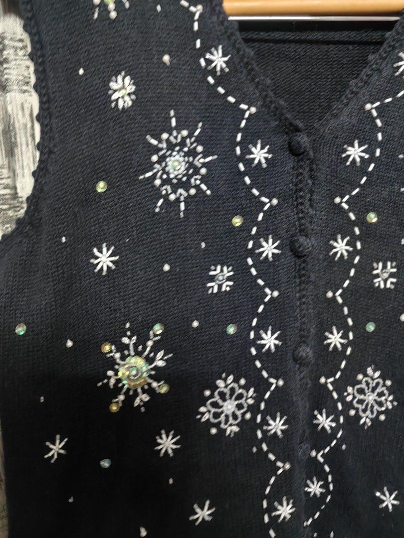 sequin snowflakes beaded fairy top (Category: Sleeveless) located in Taguig. Submitted by chielatte (Listing ID 1460412375, Image 2). Description: 00136 B40xL24 black knit sweater vest featuring silver bead and sequin snowflake embellishments.