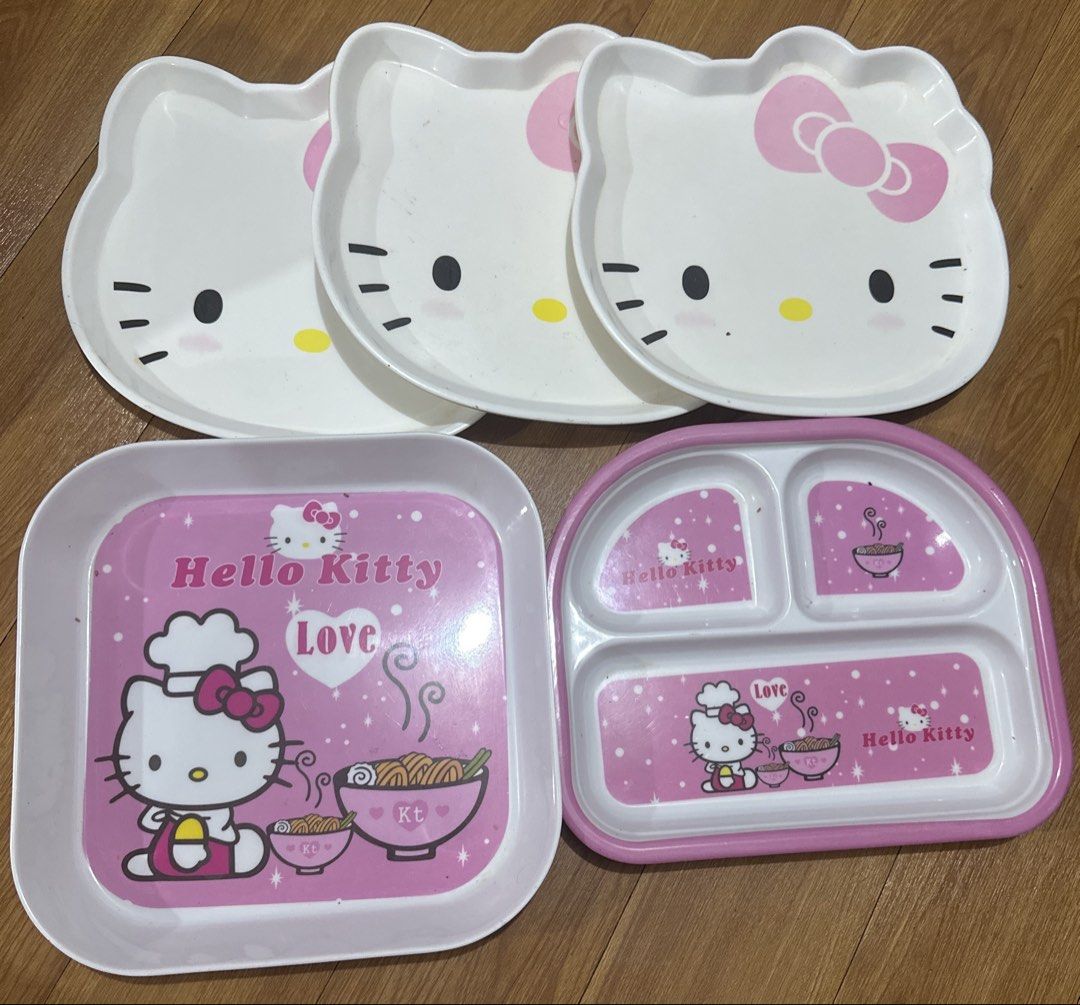 Set of 5 Hello Kitty Plates (Category: Dinnerware & Cutlery) located in Manila. Submitted by dolcedeganda (Listing ID 1460432519, Image 1). Description: - Set of 5 adorable Kitty plates - Includes 3 plates shaped like Kitty's face - 1 square plate featuring a chef Kitty design - 1 divided plate, perfect for serving different foods - Charming pink and white color scheme - Ideal for kids or any Kitty enthusiast - Please note: Some minor marks are v