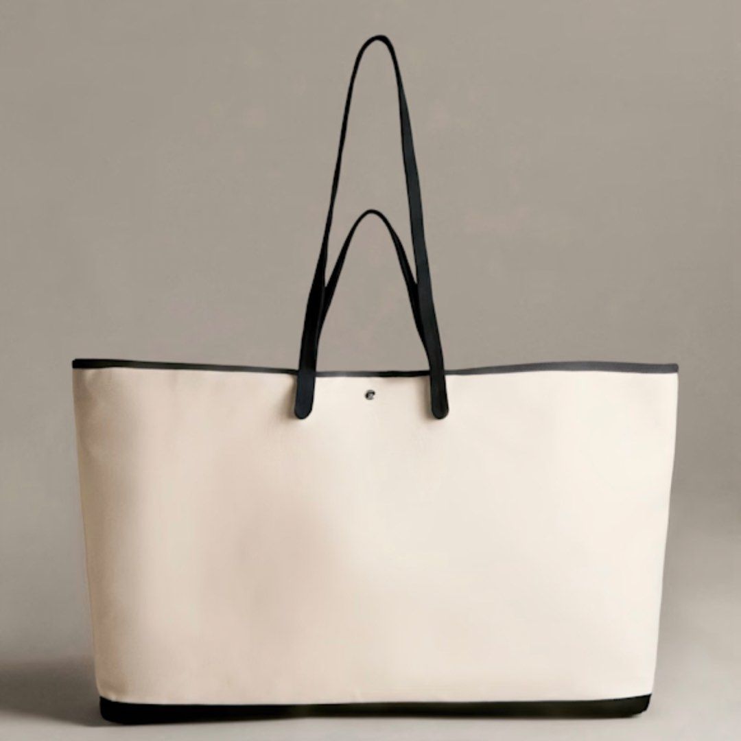 Sezane Paule Weekender Tote Bag (Category: Tote Bags) located in Quezon City. Submitted by nchm88 (Listing ID 1460361730, Image 1). Description: Paris pasabuy! Paule weekender tote - Top handle or shoulder carry - Interior: one zipped pocket and three patch pockets - Silver snap button closure - Main material: GOTS certified cotton - Lining: GOTS certified cotton - Dimensions: 21.7 x 13.8 x 8.7 in / 55 x 35 x 22 cm *For Preorder Item will arrive 