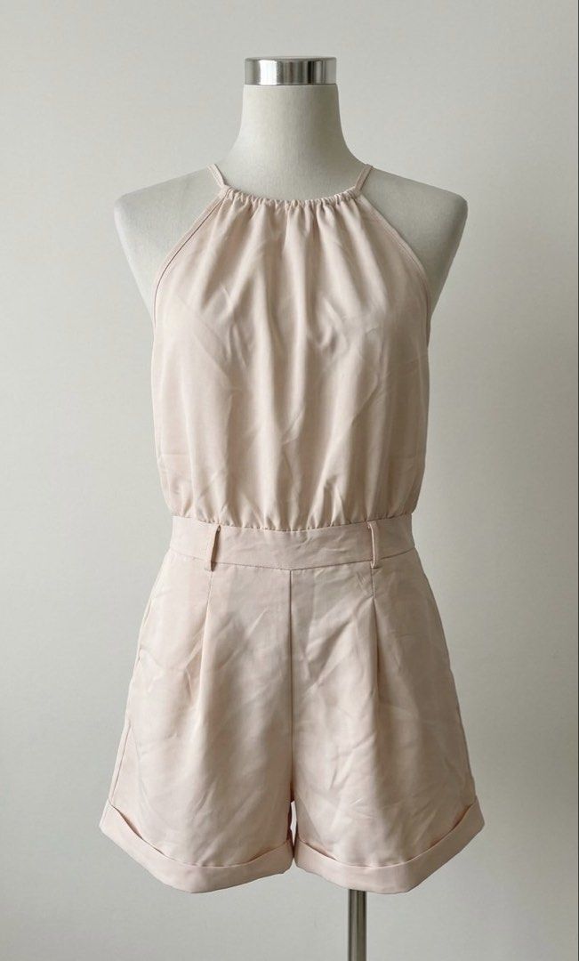 SHEIN Beige Halter Neck Romper (Category: Rompers) located in Las Pinas. Submitted by francesaly (Listing ID 1460497460, Image 1). Description: - Lightweight beige romper - Halter neck with elasticated waist - Pleated shorts with cuffed hems - Elasticated back for comfort - Versatile for casual or night out.