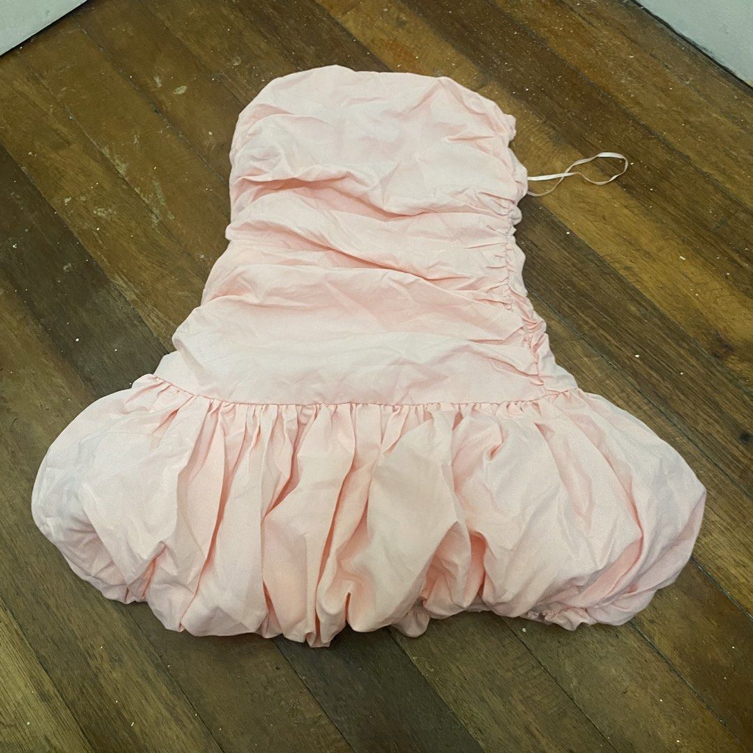 Shein Pink Ruched Strapless Bubble Hem Dress (Category: Dresses) located in Bacolor. Submitted by mxspicychicken (Listing ID 1460359350, Image 2). Description: Brand new! Never worn Xs-small - Adorable peachy pink strapless dress - Flattering ruching on the bodice - Fun and flirty bubble hem - Lightweight and flowy fabric for comfort - Includes a thin back strap (for adjustment or hanging) - Ideal for parties, dates, or a night out, birthday, gra