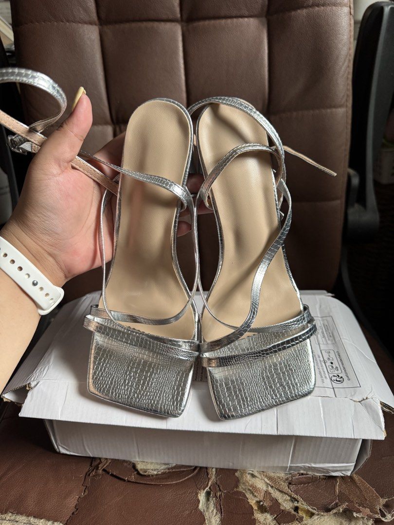 SHEIN Silver Square Toe Block Heels (Category: Heels) located in Bacoor. Submitted by issa_cd (Listing ID 1460384034, Image 3). Description: - 100% brand new - heels are 4 inches - silver with snake skin texture - medyo sira yung ibang parts ng box but it was delivered like that so ganun na siya talaga - with dustbag per shoe RFS: hindi kasya yung strap sa ankle ko 😭 Location: Molino 3, Bacoor City, Cavite • MOP: Gcash / GoTyme • Gcash: with ₱15