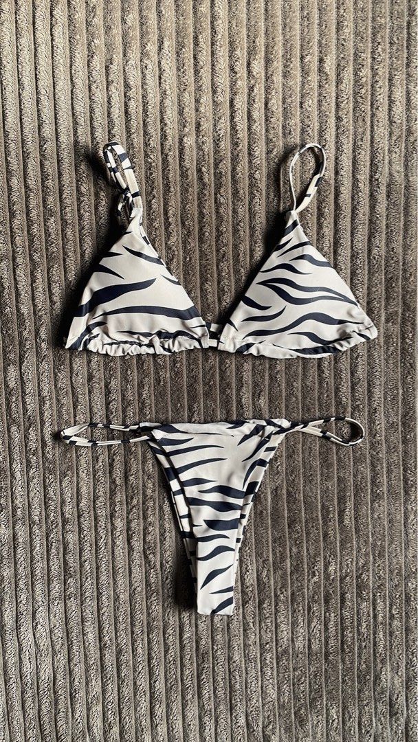 SHEIN Swim Summer Beach Zebra Stripe Bikini Set (Category: Bikinis & Swimsuits) located in Cavite. Submitted by kyrasalvad19608 (Listing ID 1460388150, Image 1). Description: - Trendy zebra print bikini set - Triangle top with adjustable straps - Color: Khaki & Black - Flaws: Used Once.