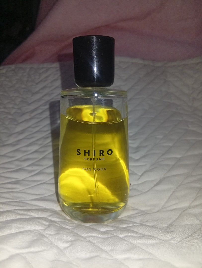 SHIRO PERFUME BON WOOD Eau de Parfum 100ml (Category: Fragrance & Deodorants) located in Davao. Submitted by lingxu23 (Listing ID 1460340489, Image 1). Description: - SHIRO BON WOOD Eau de Parfum - 100ml bottle - Made in Japan - Ideal for everyday wear - Clear glass bottle with black cap - Golden yellow liquid.