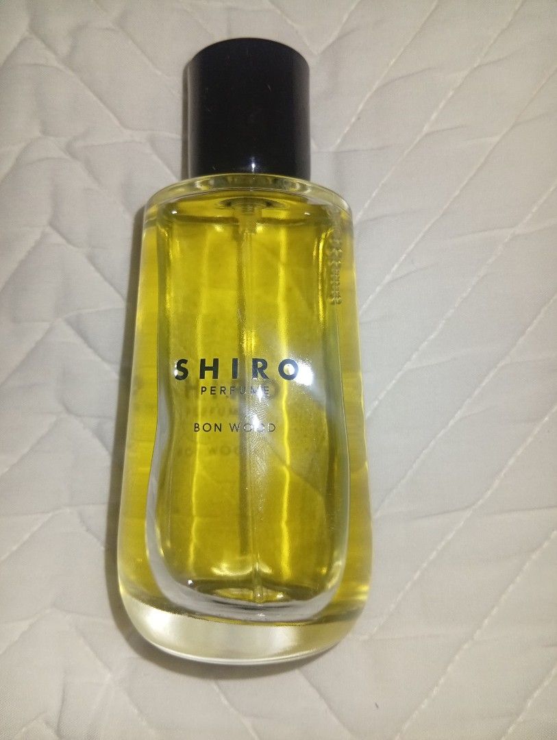 SHIRO PERFUME BON WOOD Eau de Parfum 100ml (Category: Fragrance & Deodorants) located in Davao. Submitted by lingxu23 (Listing ID 1460340489, Image 2). Description: - SHIRO BON WOOD Eau de Parfum - 100ml bottle - Made in Japan - Ideal for everyday wear - Clear glass bottle with black cap - Golden yellow liquid.