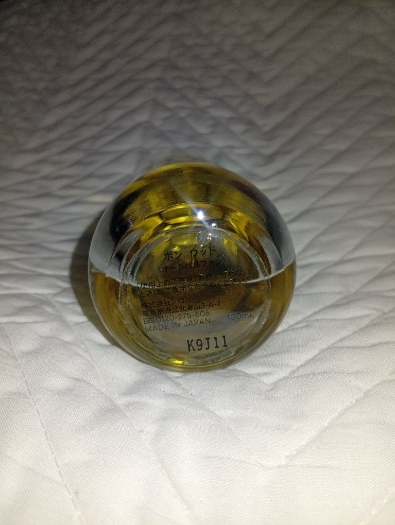 SHIRO PERFUME BON WOOD Eau de Parfum 100ml (Category: Fragrance & Deodorants) located in Davao. Submitted by lingxu23 (Listing ID 1460340489, Image 3). Description: - SHIRO BON WOOD Eau de Parfum - 100ml bottle - Made in Japan - Ideal for everyday wear - Clear glass bottle with black cap - Golden yellow liquid.