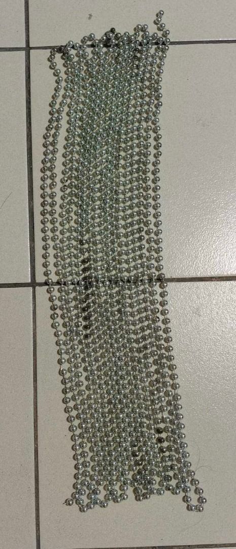 XMAS DISCOUNT!!! Silver Beaded Chain Strand for Christmas Tree or Decoration (Category: Other Home Decor) located in Quezon City. Submitted by oddduck02 (Listing ID 1460374366, Image 2). Description: - Silver-toned bead strands for Christmas Tree or Decoration - Round, uniform beads - Connected by a thin chain - L = 25ft. + 9inches - Beads are 1/4in in diameter - Reason for selling = Cleaning house - Strand has a few beads that are tarnished .