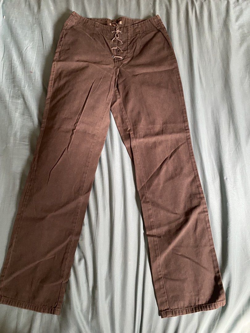 Sisley Basic Denim High-Waist Lace-Up Pants (Category: Looking For) located in Paranaque City. Submitted by hershop.sbt (Listing ID 1459344394, Image 3). Description: Lace-Up Waistband: Highlighting the authentic front tie closure. Durable Cotton Denim: Premium brown pre-washed denim fabric. Straight-Leg Fit: Classic cut for easy styling. Breathable Fabric & Reinforced Seams: Built for comfort.