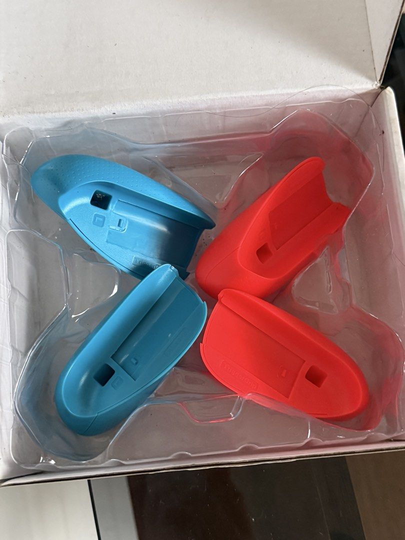 Skull & Co. Joy Grip for Nintendo Switch Neon Red & Blue (Category: Controllers) located in Manila. Submitted by carlaleyyydonato (Listing ID 1460396473, Image 3). Description: - Enhance handheld comfort with the Skull & Co. Joy Grip. - Designed for Neon Red & Blue Joy-Cons. - Makes extended gaming sessions more enjoyable. - Comes with original packaging. - All original parts included. Bought it for 2,100.