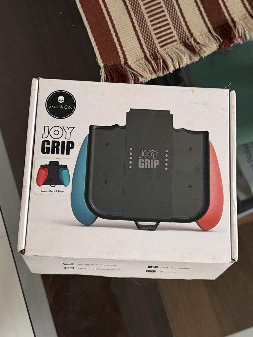 Skull & Co. Joy Grip for Nintendo Switch Neon Red & Blue (Category: Controllers) located in Manila. Submitted by carlaleyyydonato (Listing ID 1460396473, Image 1). Description: - Enhance handheld comfort with the Skull & Co. Joy Grip. - Designed for Neon Red & Blue Joy-Cons. - Makes extended gaming sessions more enjoyable. - Comes with original packaging. - All original parts included. Bought it for 2,100.