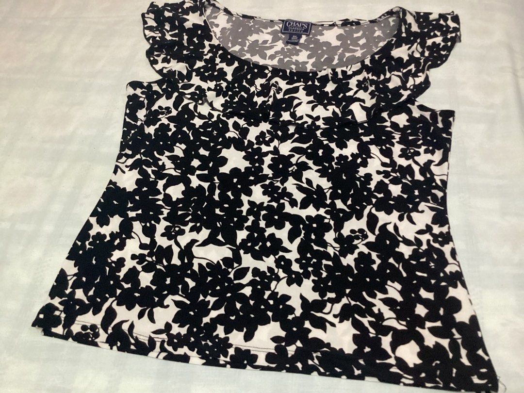 Sleeveless Top from Chaps (Category: Sleeveless) located in Davao. Submitted by ferdipt (Listing ID 1460425555, Image 3). Description: Floral print sleeveless top with round neckline and ruffled trim. Size Classic Petite. Made in Jordan 96% Polyester, 4% Elastane L:21 inches Armpit to Armpit: 18 inches .