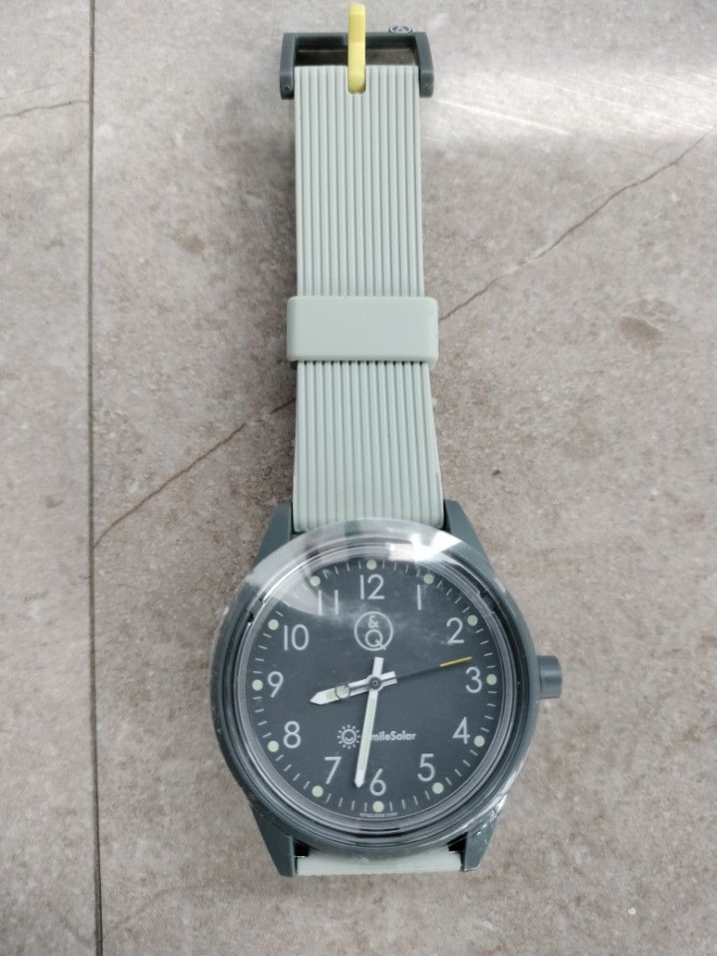 SmileSolar Watch Light Powered Grey Strap (Category: Women's Watches) located in Quezon City. Submitted by eduvilla1250235 (Listing ID 1460351515, Image 2). Description: - SmileSolar light-powered watch - Grey strap with yellow keeper - Dark grey watch face with clear hour markers - Simple and functional design - Comes in original packaging - 40mm case diameter 20mm lug width.