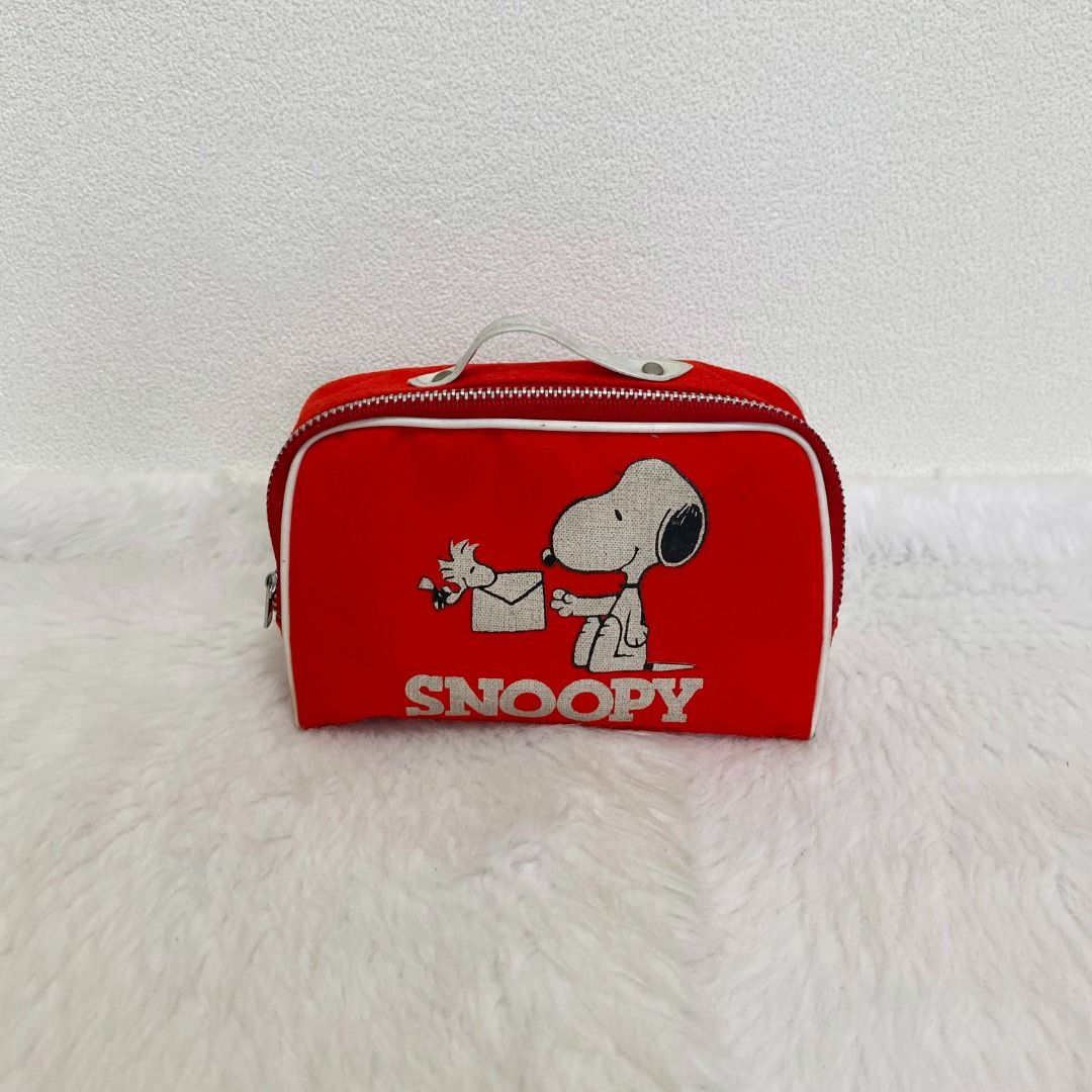 Snoopy Vintage Red Nylon Pouch (Category: Purses & Pouches) located in Cebu City. Submitted by posh_avenue888 (Listing ID 1460465537, Image 1). Description: In very good condition. From Japan. Crafted in nylon. 100% authentic!!! 6" x 3.5" x 2"..