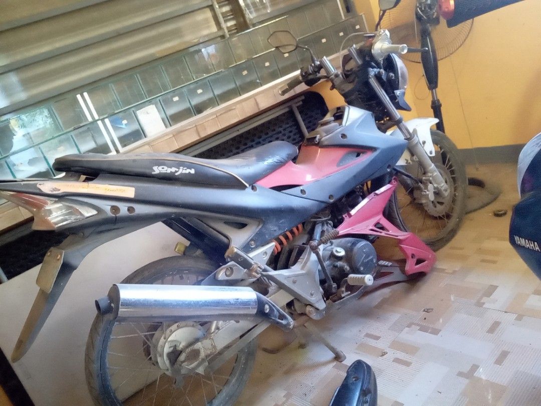 Sonjin Motorcycle - Pink and Gray (Category: Motorbikes for Sale) located in Manila. Submitted by jayjay2484 (Listing ID 1460502443, Image 1). Description: - Pink and gray Sonjin motorcycle - Sonjin logo on the seat - Silver exhaust pipe - Tires have some wear - Ready for a new owner.